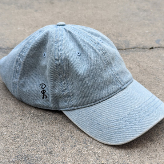 Stay 'luse denim hat in light blue. Jaunty Man embroidered on right side.